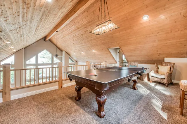 a view of a house with a yard and sitting area