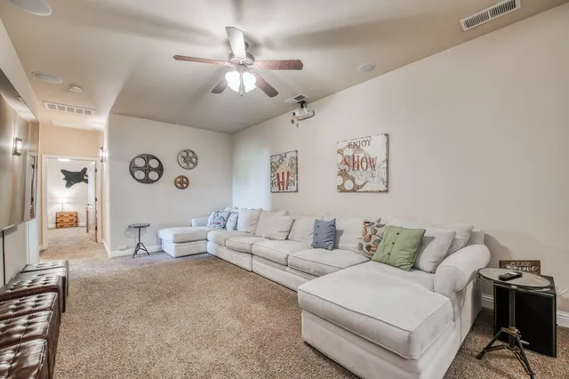 a view of a house with yard and sitting area