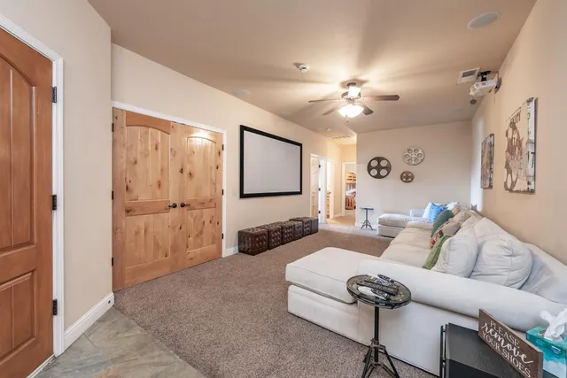 a view of a house with a wooden deck and a backyard