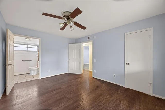 a view of an empty room and wooden floor
