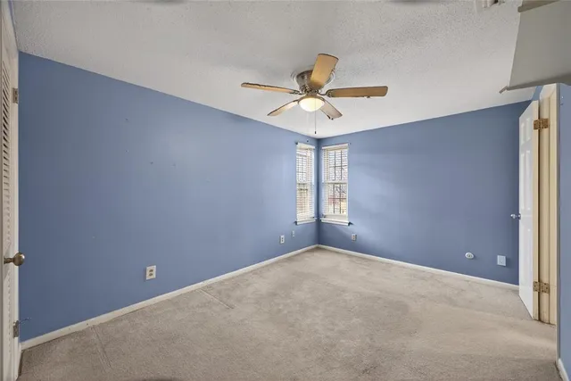 a view of a big room with carpet