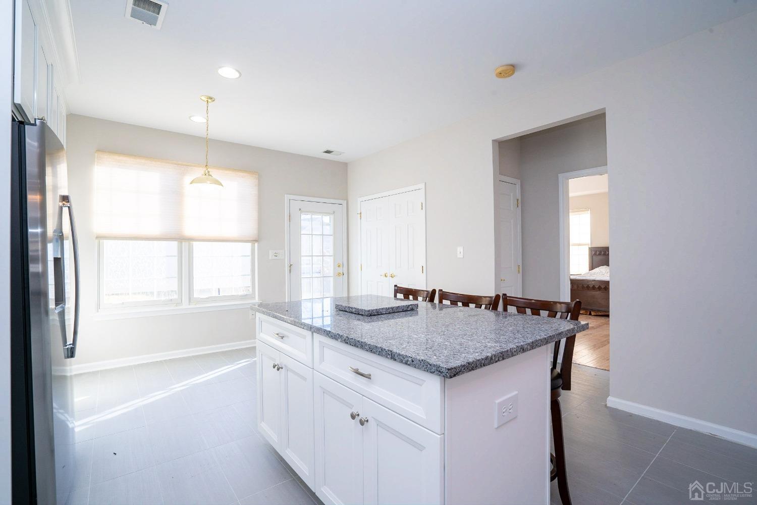 7 Stony Path Dayton, NJ 08810 - Photo 15 of 33 a bathroom with a granite countertop sink and a window