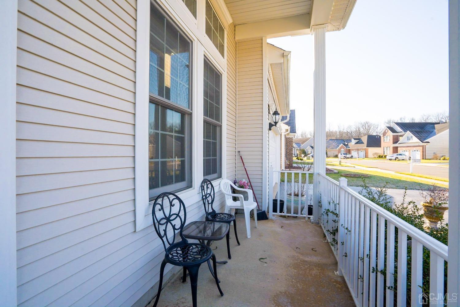 7 Stony Path Dayton, NJ 08810 - Photo 2 of 33 a view of a patio with table and chairs and wooden floor