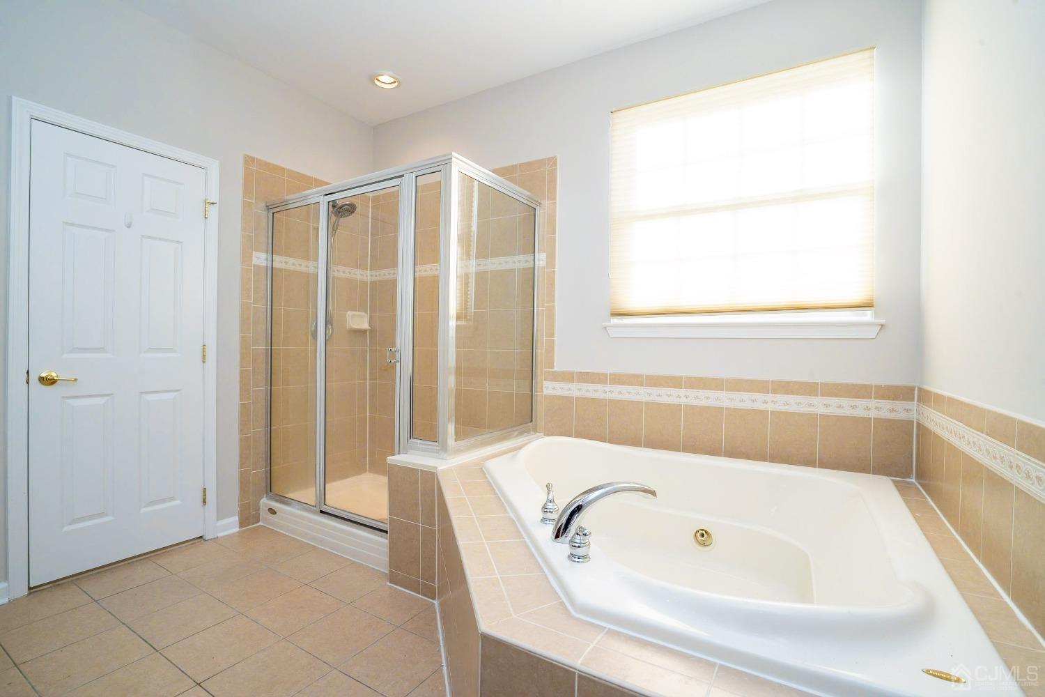 7 Stony Path Dayton, NJ 08810 - Photo 21 of 33 a bathroom with a tub and shower