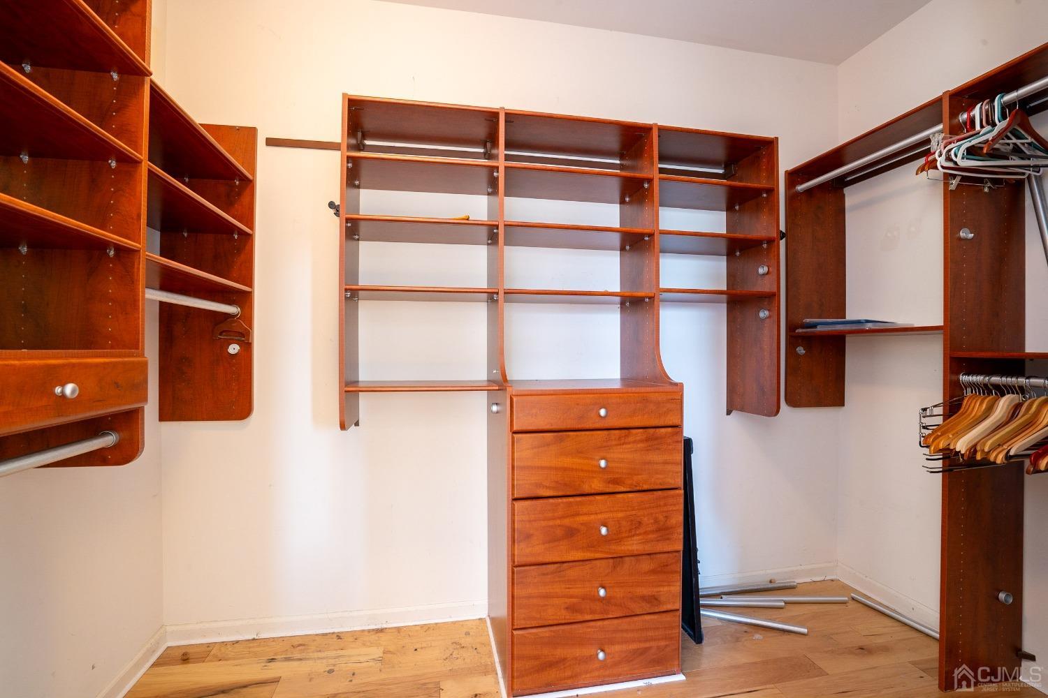 7 Stony Path Dayton, NJ 08810 - Photo 22 of 33 a view of walk in closet with clothes and shoes