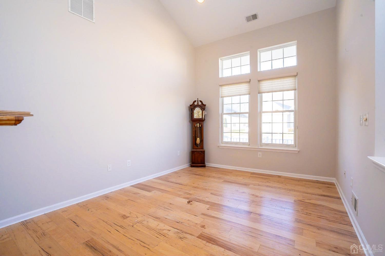 7 Stony Path Dayton, NJ 08810 - Photo 4 of 33 an empty room with wooden floor and windows