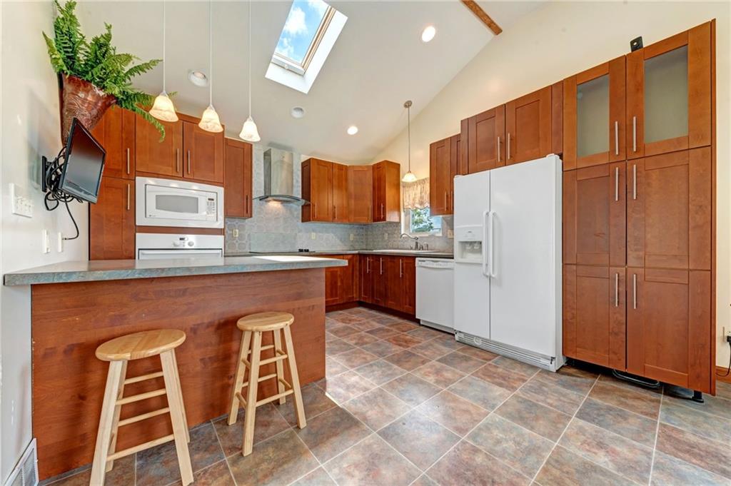 614 Virginia Avenue Rochester, PA 15074 - Photo 8 of 23 a kitchen with stainless steel appliances granite countertop a refrigerator and a stove top oven