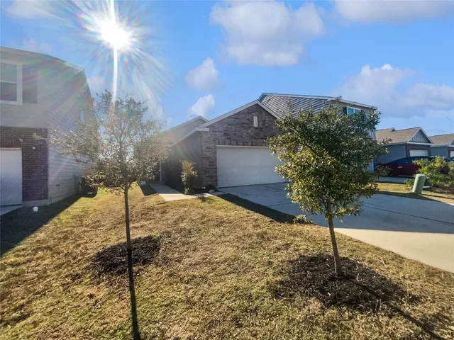 a backyard of a house with lots of green space