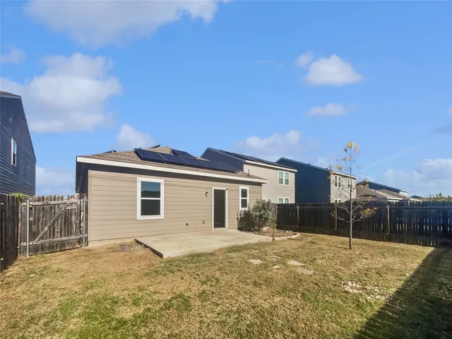 a house view with a backyard space