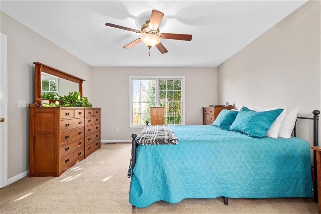 386 Pine Ridge Drive Venetia, PA 15367 - Photo 13 of 25 a bedroom with a bed and a dresser in it
