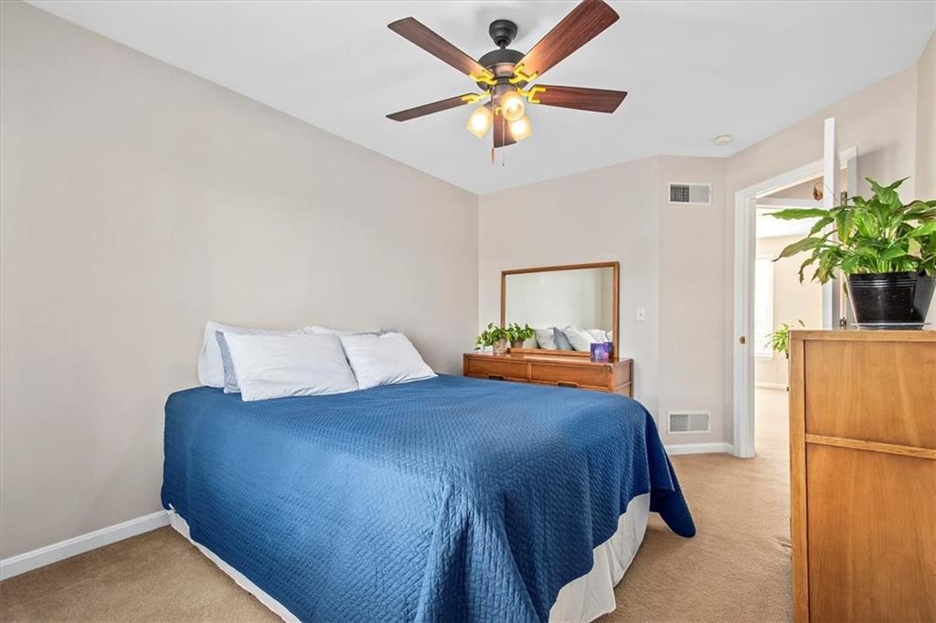 386 Pine Ridge Drive Venetia, PA 15367 - Photo 16 of 25 a bedroom with a bed and a chandelier