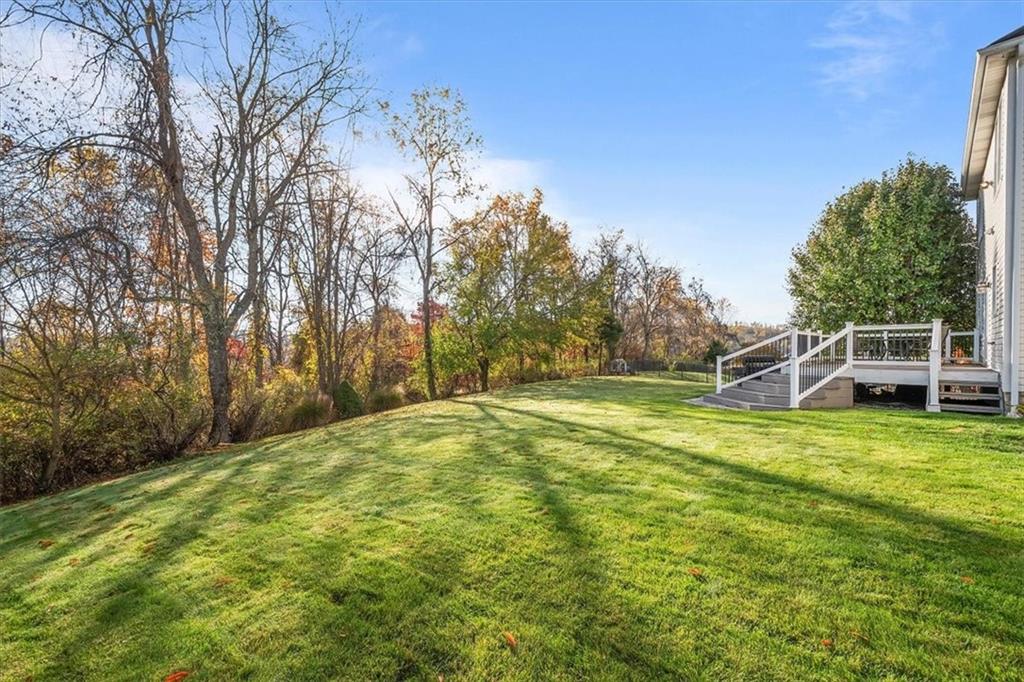386 Pine Ridge Drive Venetia, PA 15367 - Photo 24 of 25 a yard with a house and trees in the background