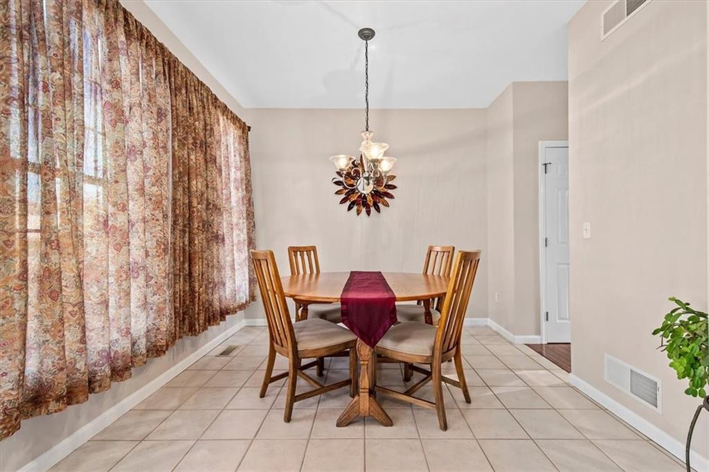 386 Pine Ridge Drive Venetia, PA 15367 - Photo 3 of 25 a view of a dining room with furniture and chandelier