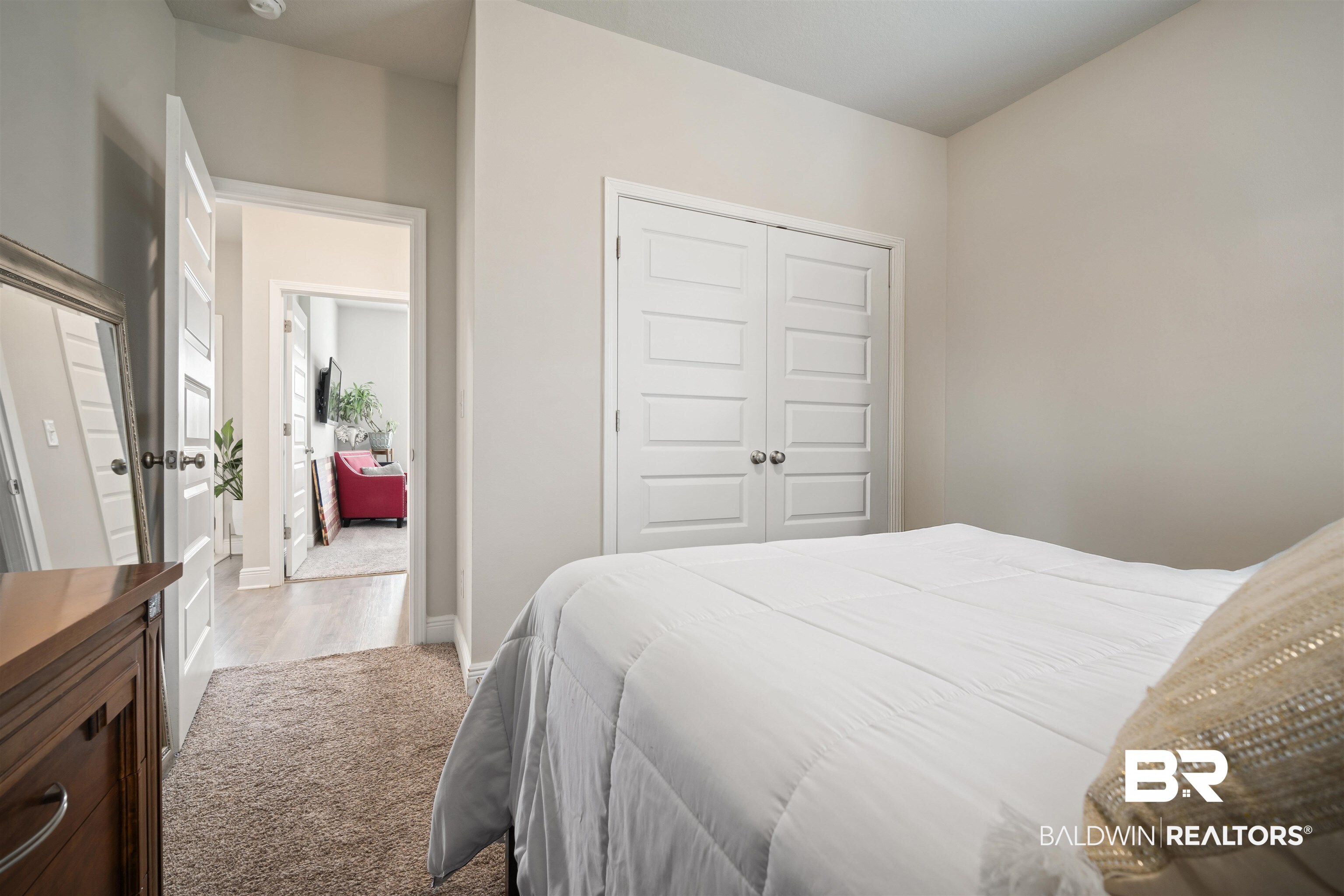 10474 Loamy Avenue Mobile, AL 36695 - Photo 24 of 31 Bedroom with a closet, carpet flooring, and wood finished floors