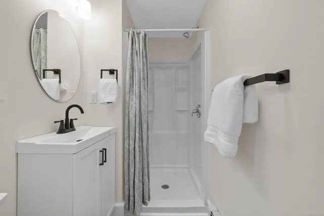 a bathroom with a sink and mirror
