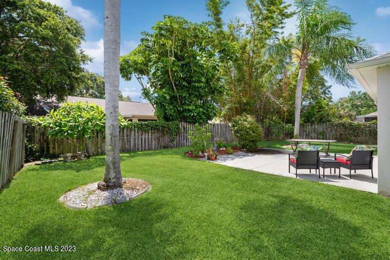 1102 Sunday Drive Rockledge, FL 32955 - Photo 14 of 16 a view of a garden with a tree