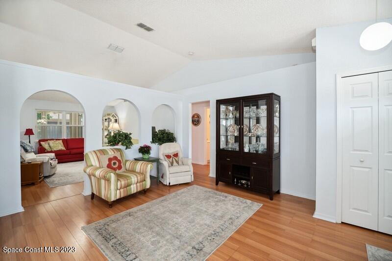 1102 Sunday Drive Rockledge, FL 32955 - Photo 2 of 16 a living room with furniture and wooden floor