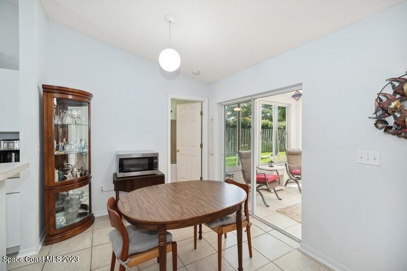 1102 Sunday Drive Rockledge, FL 32955 - Photo 4 of 16 a view of a dining room with furniture window and outside view
