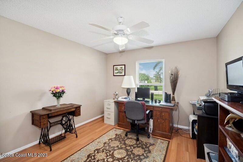 1102 Sunday Drive Rockledge, FL 32955 - Photo 9 of 16 a view of a workspace with furniture and a window
