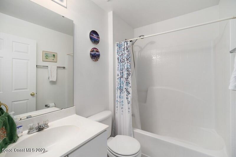 1102 Sunday Drive Rockledge, FL 32955 - Photo 10 of 16 a bathroom with a sink toilet and shower