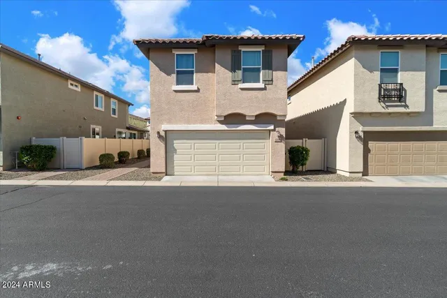a view of a house with a street
