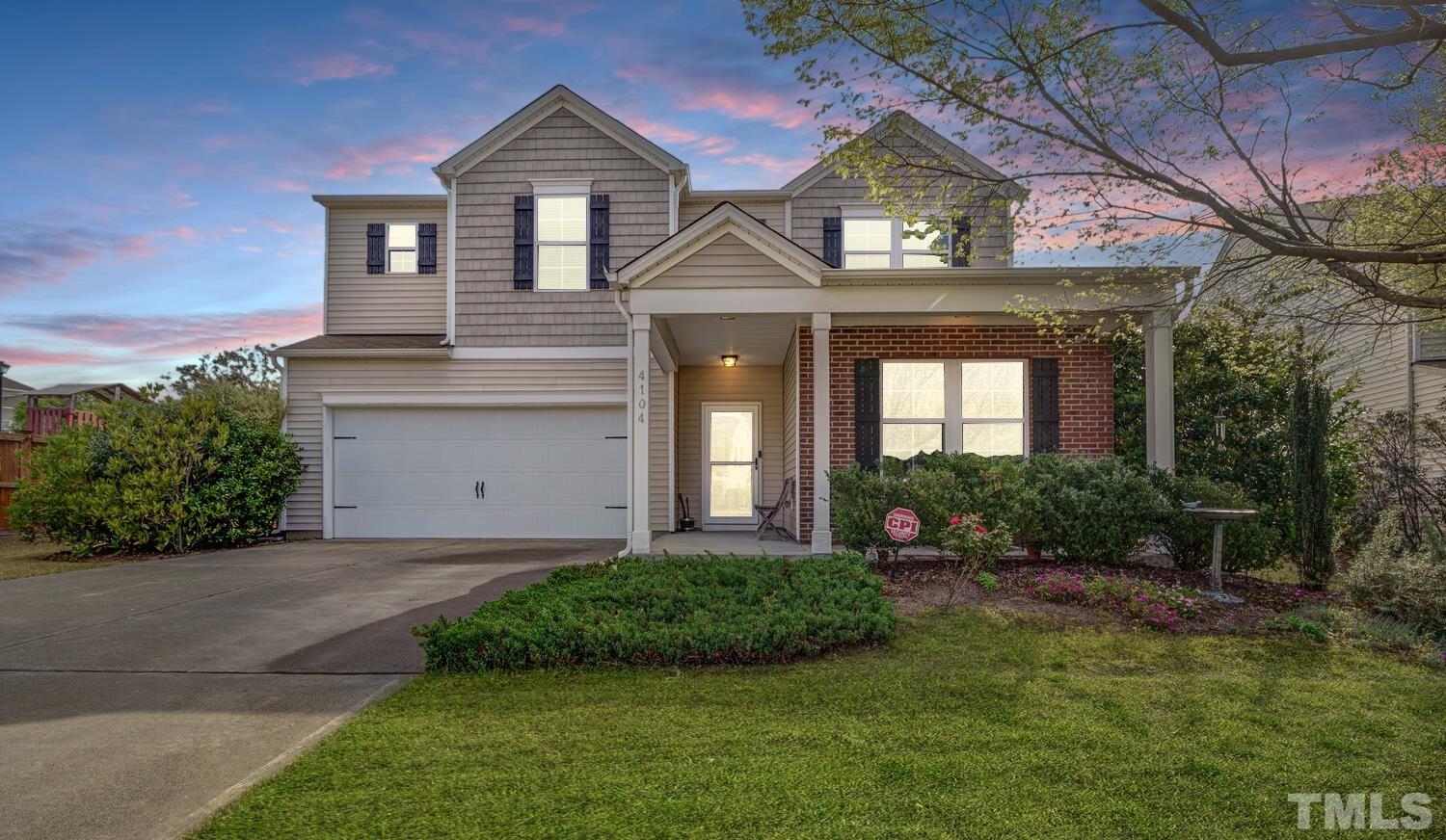 4104 Burnaby Street Raleigh, NC 27616 - Photo 2 of 59 a front view of a house with a yard