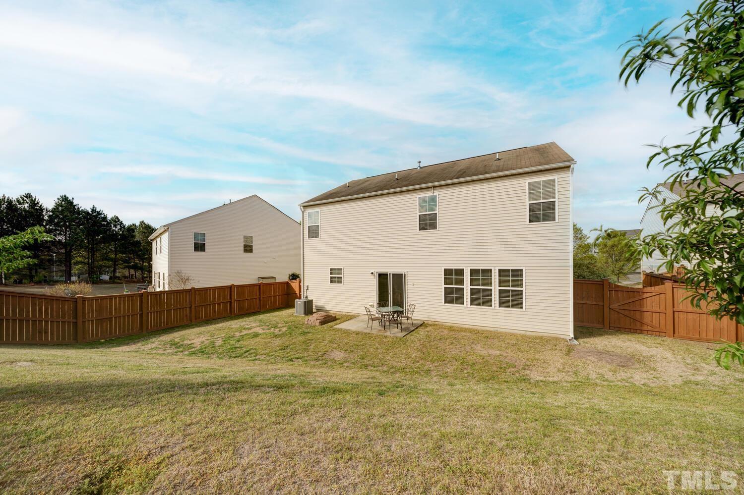 4104 Burnaby Street Raleigh, NC 27616 - Photo 3 of 59 a view of a house with backyard and tree