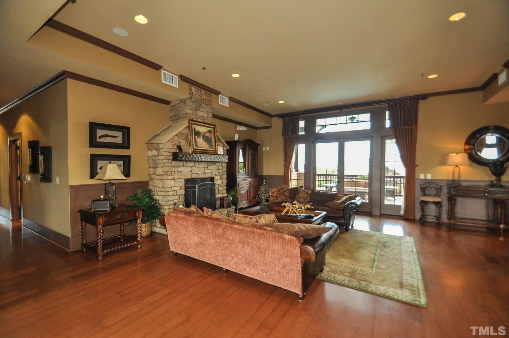 4104 Burnaby Street Raleigh, NC 27616 - Photo 44 of 59 a living room with fireplace furniture and a wooden floor