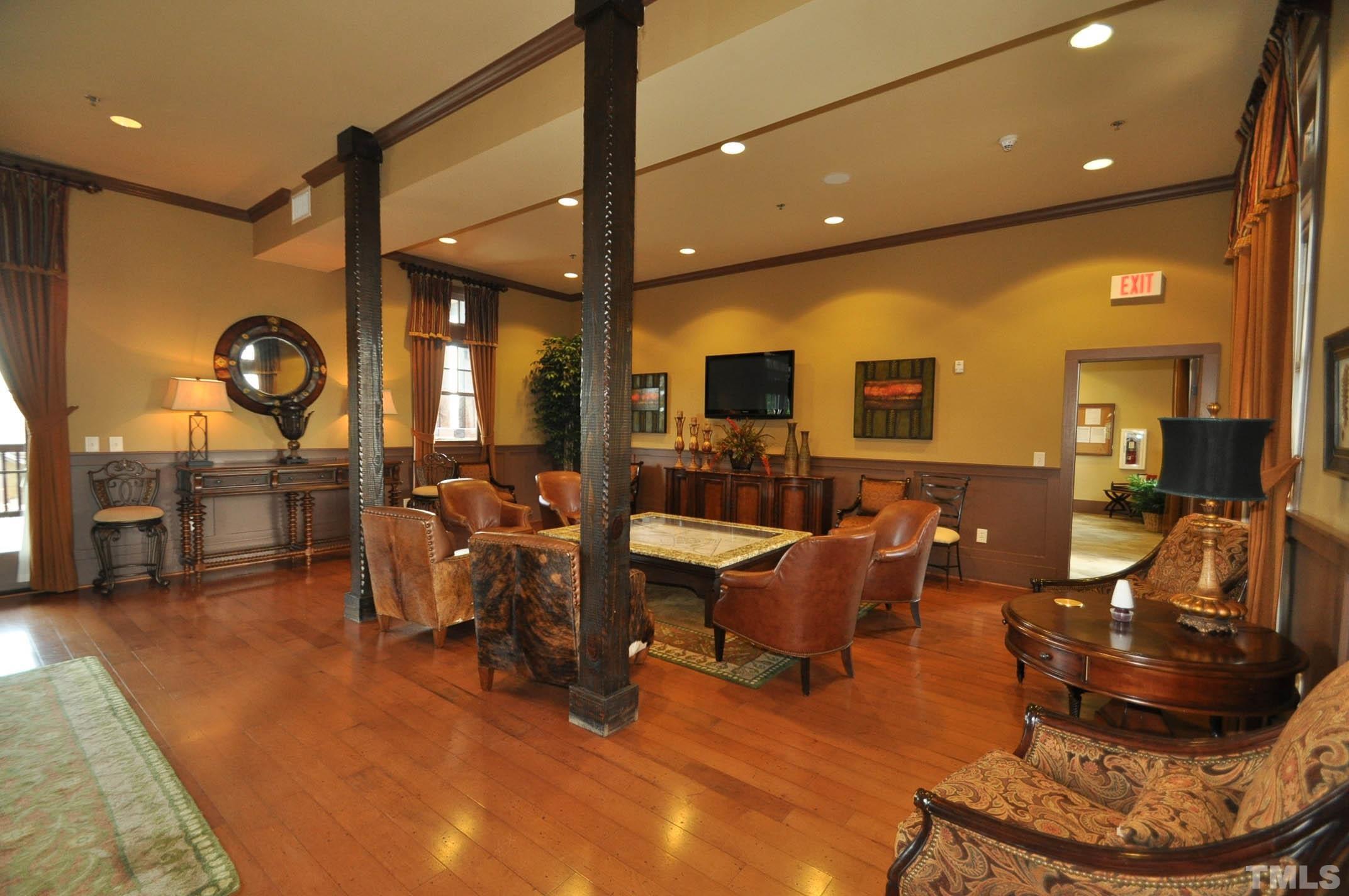 4104 Burnaby Street Raleigh, NC 27616 - Photo 45 of 59 a living room with furniture and a wooden floor