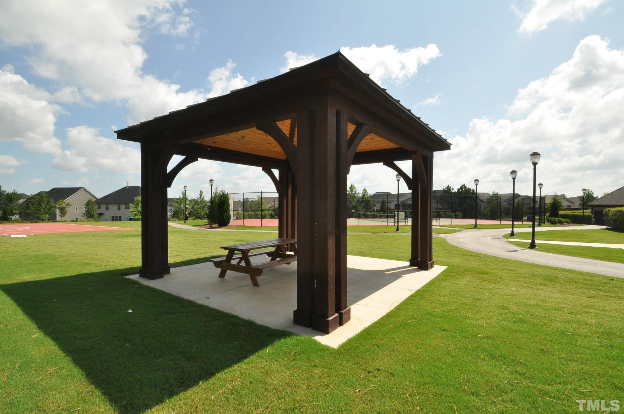 4104 Burnaby Street Raleigh, NC 27616 - Photo 50 of 59 a view of a green field with sitting area