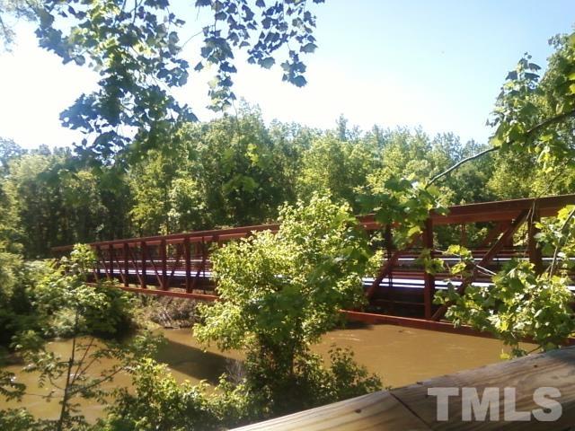 4104 Burnaby Street Raleigh, NC 27616 - Photo 56 of 59 a view of swimming pool with lawn chairs and plants