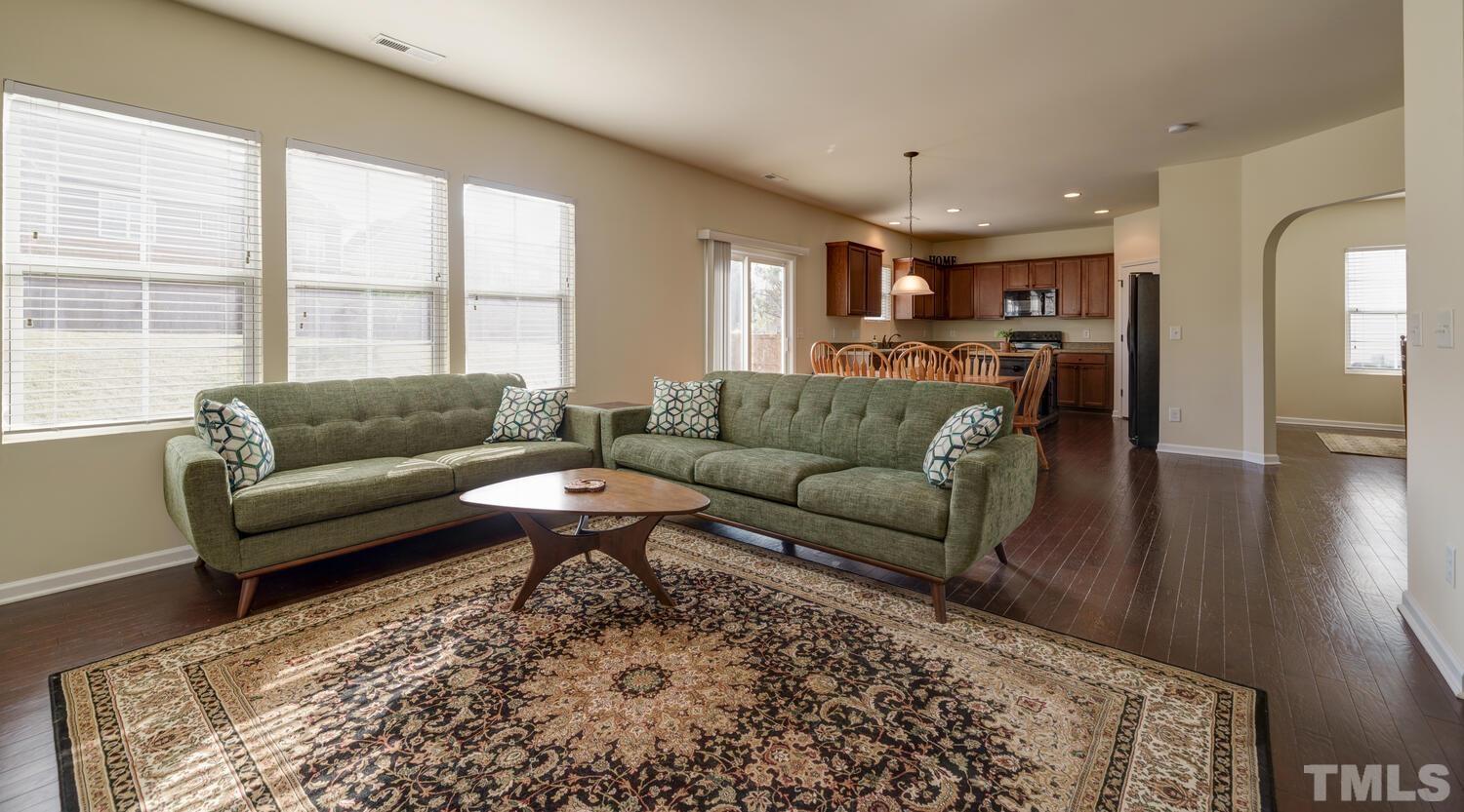 4104 Burnaby Street Raleigh, NC 27616 - Photo 6 of 59 a living room with furniture and a large window