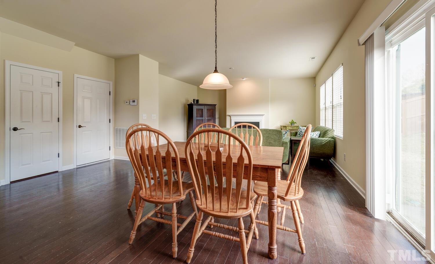 4104 Burnaby Street Raleigh, NC 27616 - Photo 7 of 59 a dining room with furniture window wooden floor
