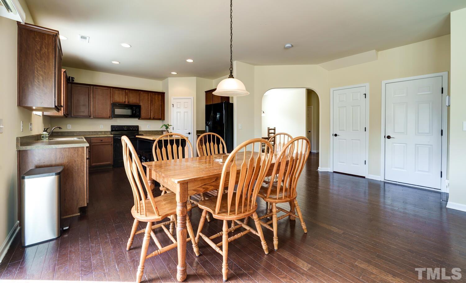 4104 Burnaby Street Raleigh, NC 27616 - Photo 10 of 59 a dining room with furniture and wooden floor