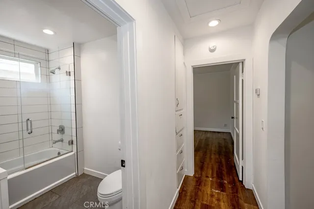 a bathroom with a shower and a toilet