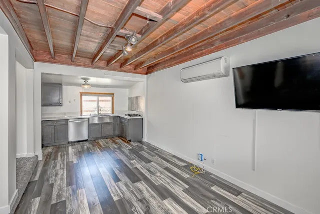 a kitchen with a sink stainless steel appliances and counter space