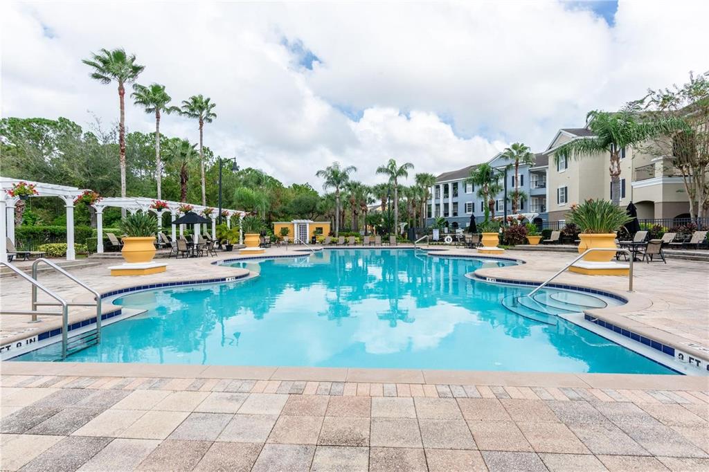 3611 Conroy Road, Unit 834 Orlando, FL 32839 - Photo 16 of 22 an outdoor space with swimming pool and furniture
