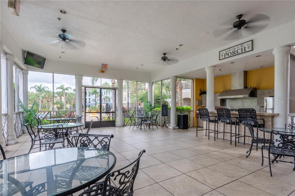 3611 Conroy Road, Unit 834 Orlando, FL 32839 - Photo 18 of 22 a room with lots of tables a large window and chairs