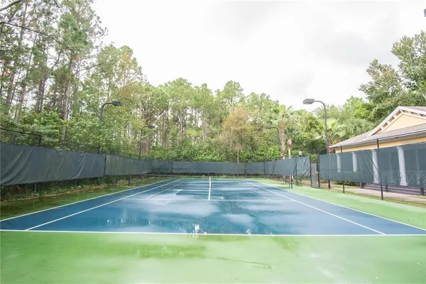 a view of a backyard with swimming pool