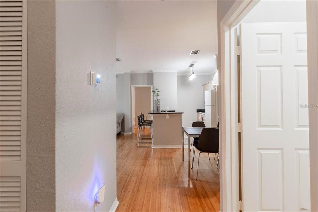 3611 Conroy Road, Unit 834 Orlando, FL 32839 - Photo 6 of 22 a view of a living room with furniture and wooden floor