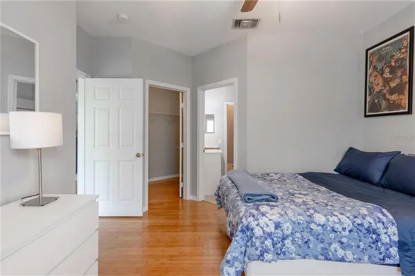 a bedroom with a bed and a cabinets