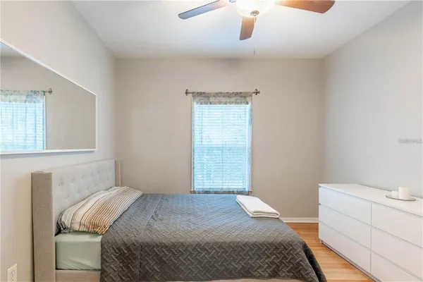 a bedroom with a bed and a dresser