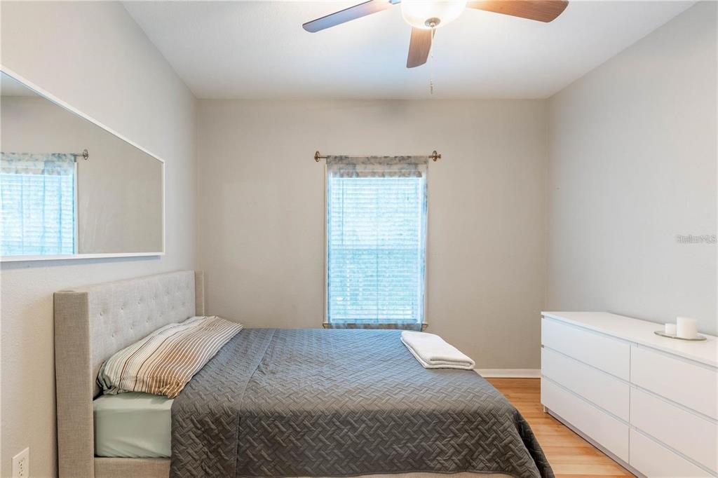 3611 Conroy Road, Unit 834 Orlando, FL 32839 - Photo 9 of 22 a bedroom with a bed and a dresser