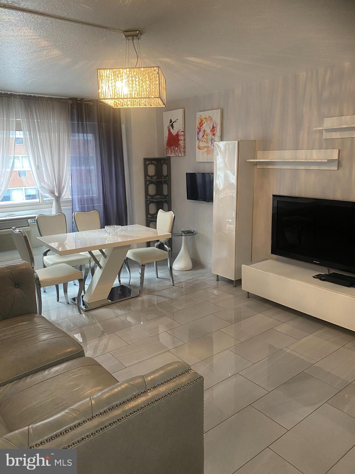 2101 Chestnut Street, Unit 519 Philadelphia, PA 19103 - Photo 16 of 21 a living room with furniture and a fireplace