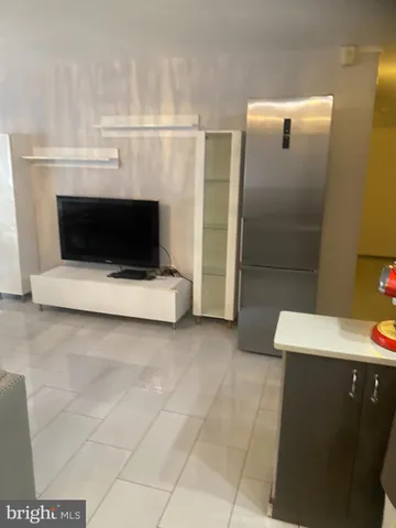 a bathroom with a sink a toilet and a shower