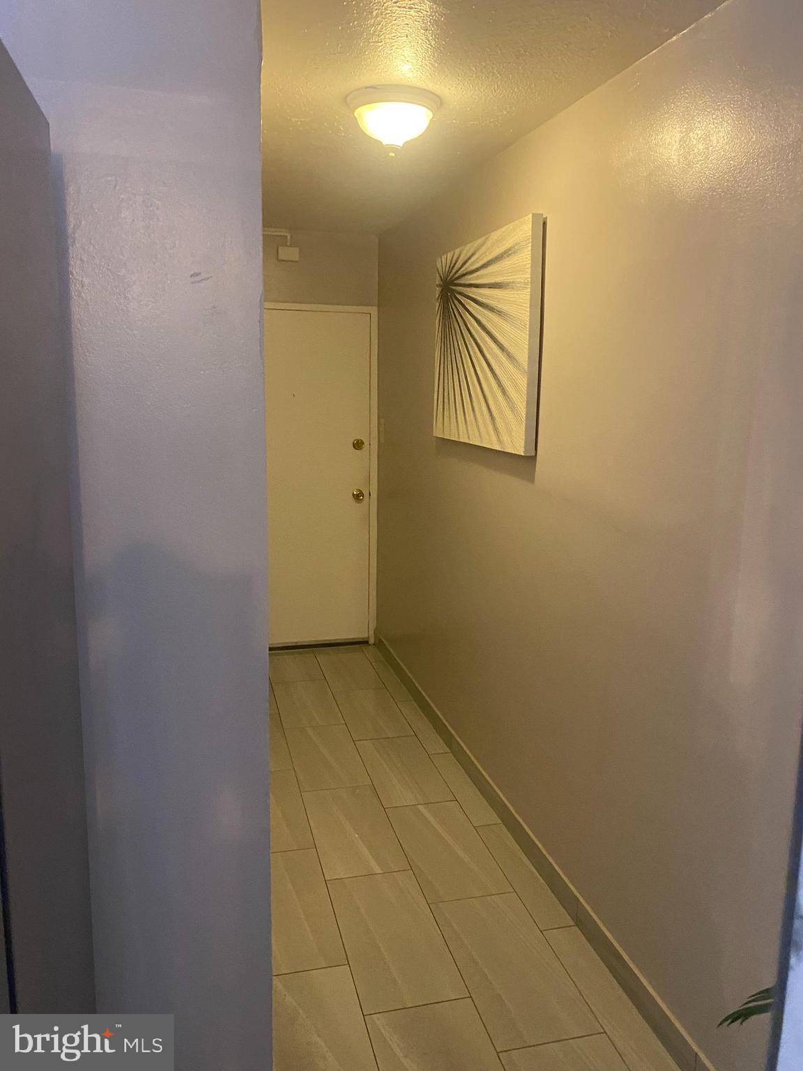 2101 Chestnut Street, Unit 519 Philadelphia, PA 19103 - Photo 4 of 21 a view of hallway with paintings on the wall