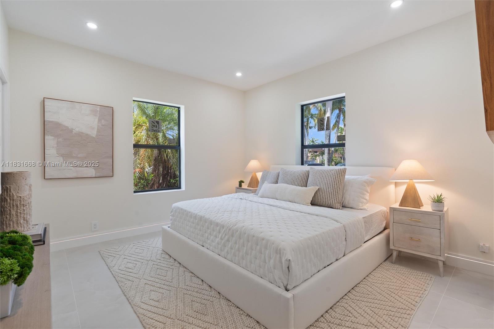 1108 Harrison Street Hollywood, FL 33019 - Photo 12 of 19 a bedroom with a large bed and a window