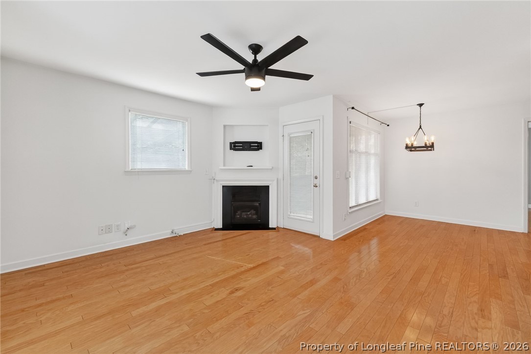 1221 Westview Lane, Unit 301 Raleigh, NC 27605 - Photo 10 of 32 a view of empty room with fan and windows