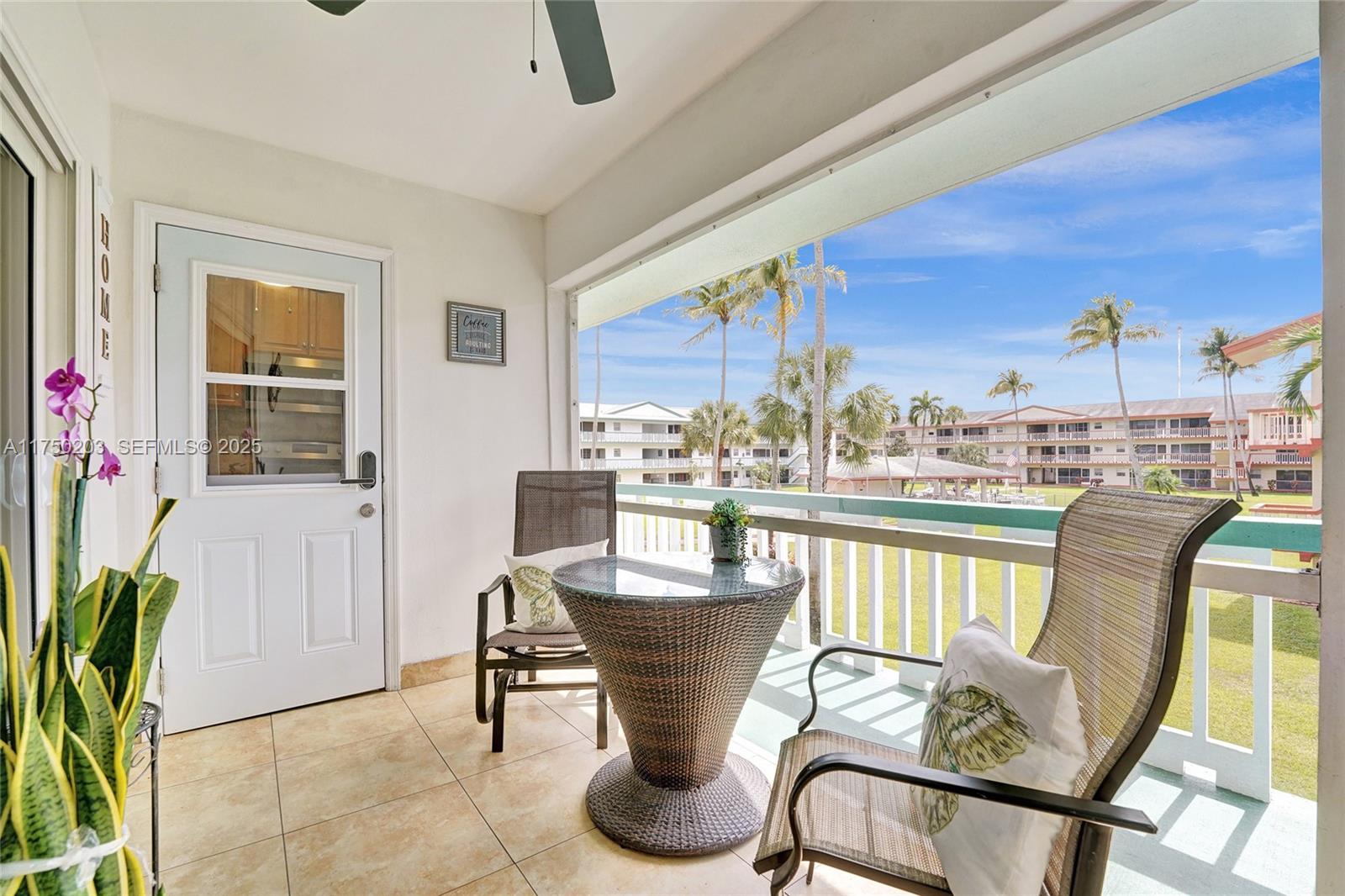5300 Washington Street, Unit I203 Hollywood, FL 33021 - Photo 13 of 75 a dining room with furniture and a floor to ceiling window