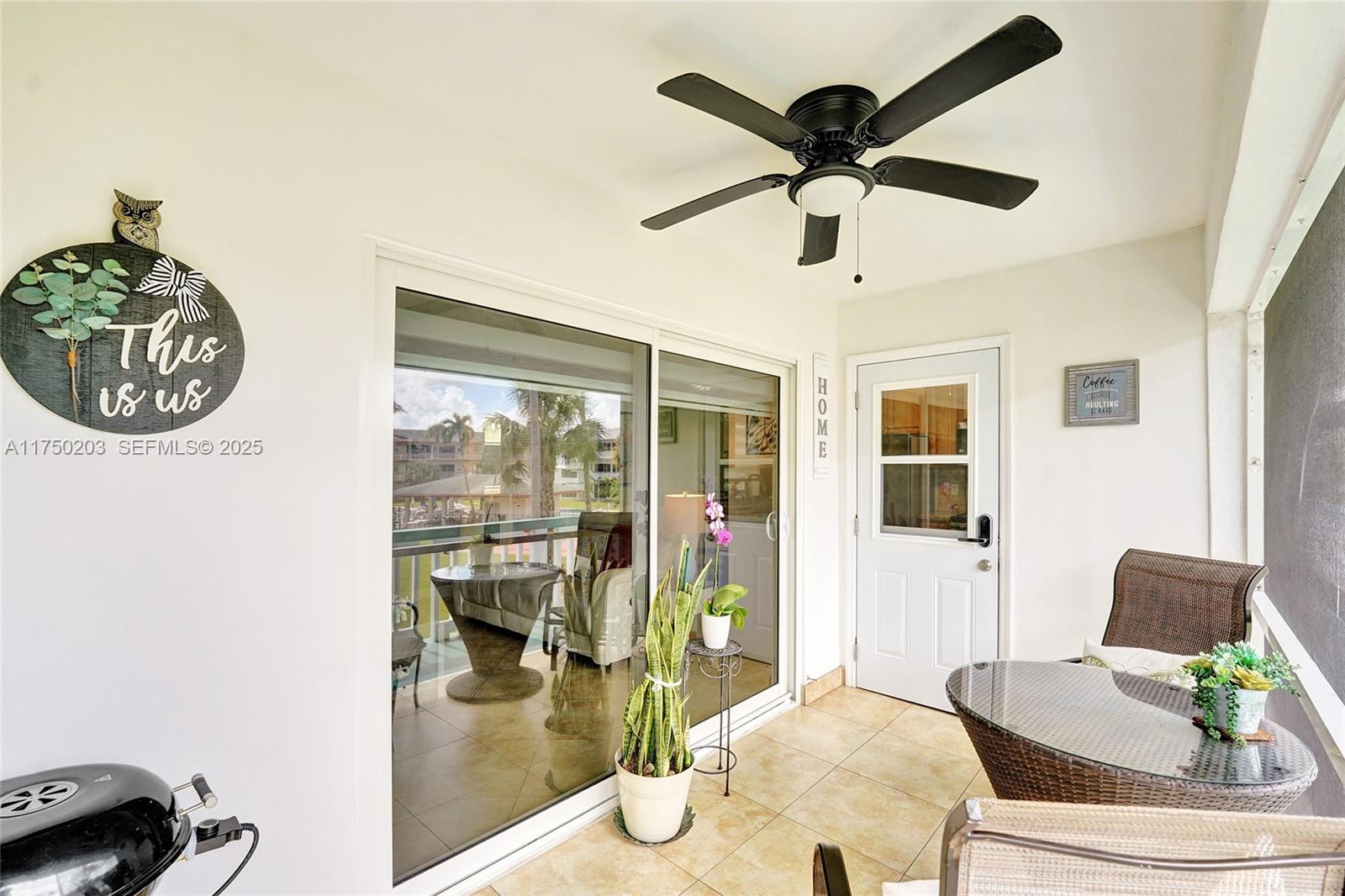 5300 Washington Street, Unit I203 Hollywood, FL 33021 - Photo 15 of 75 a living room with furniture and a window